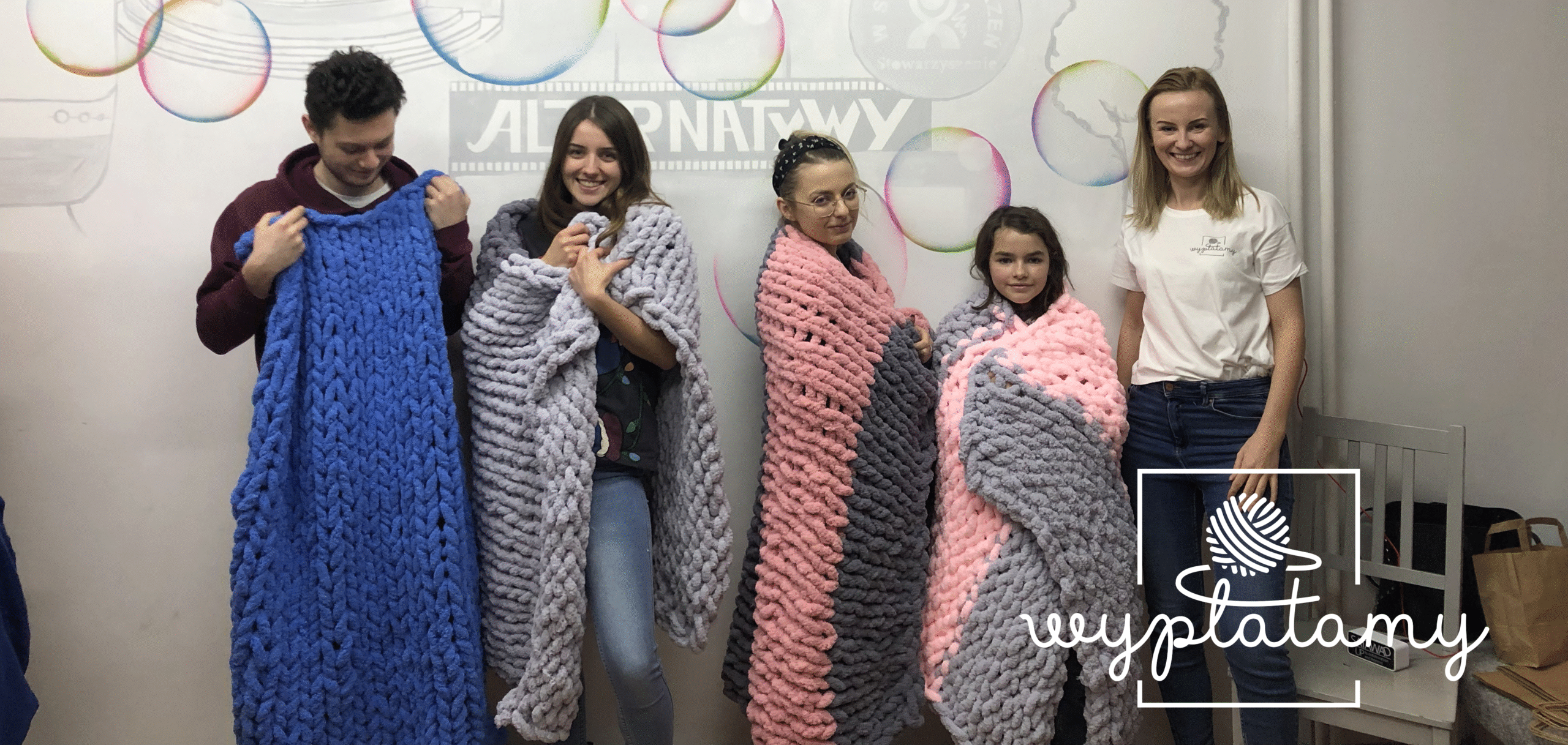 Blanket weaving workshop - participants present the blankets they have woven