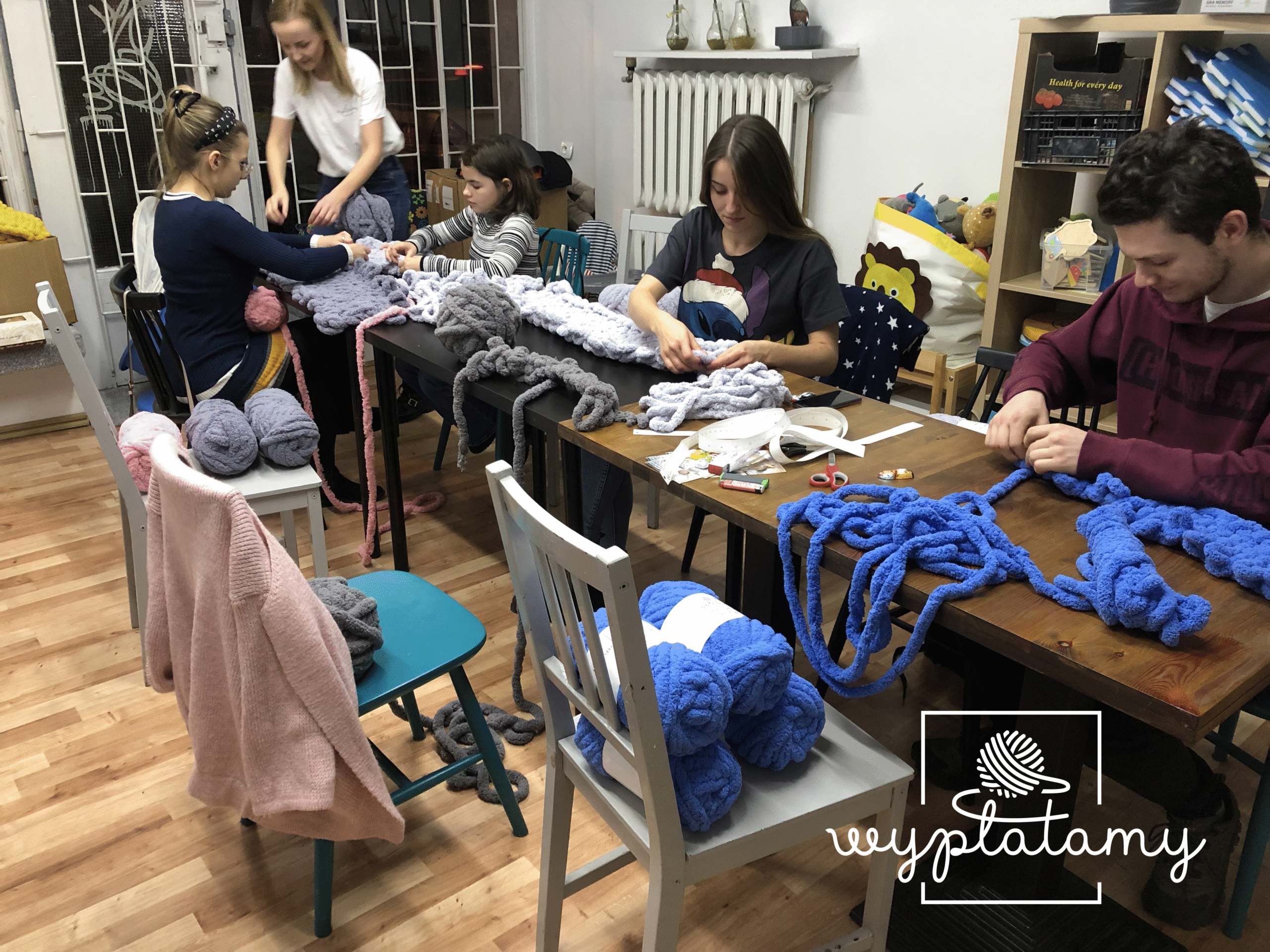 Blanket weaving workshop - participants create blankets in concentration